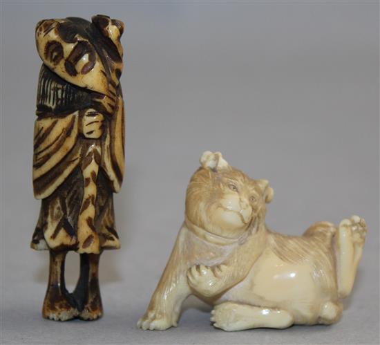 A Japanese ivory figure of a cat and a stag horn netsuke, 5.8cm